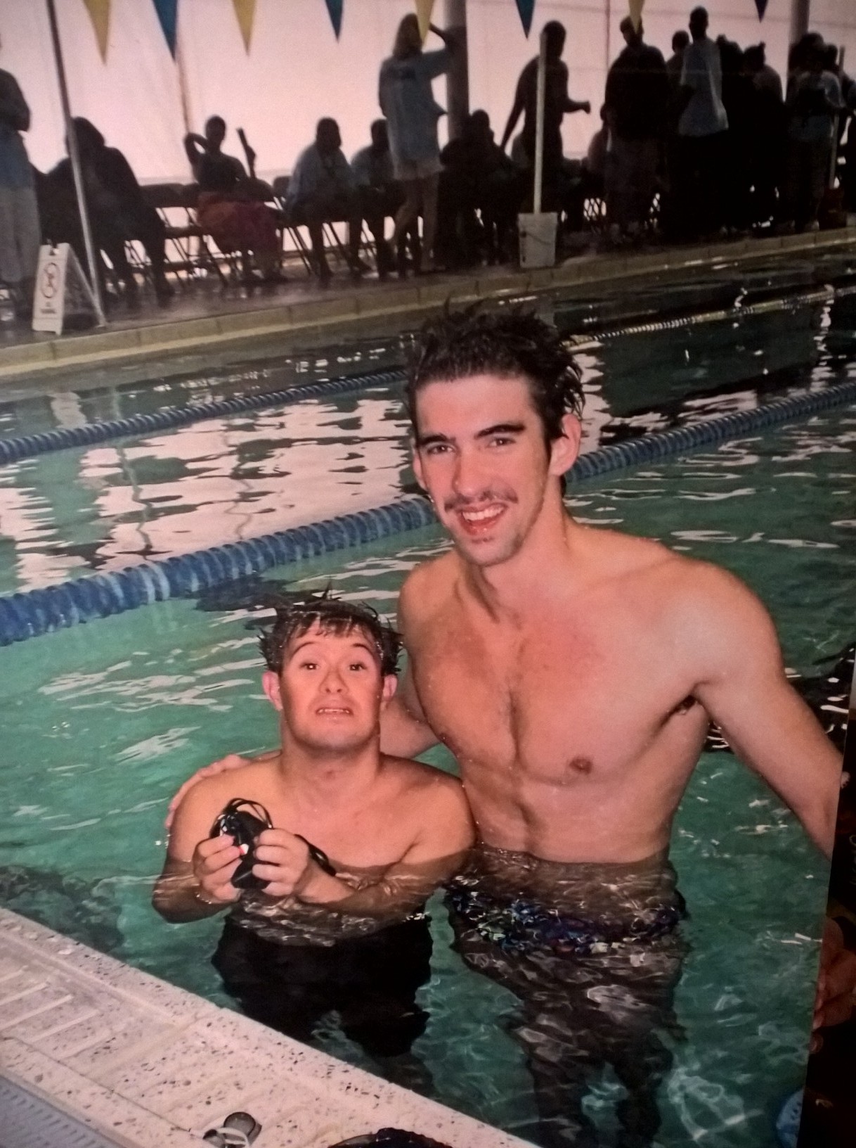 Miyares swimming with Olympic gold medalist Michael Phelps.