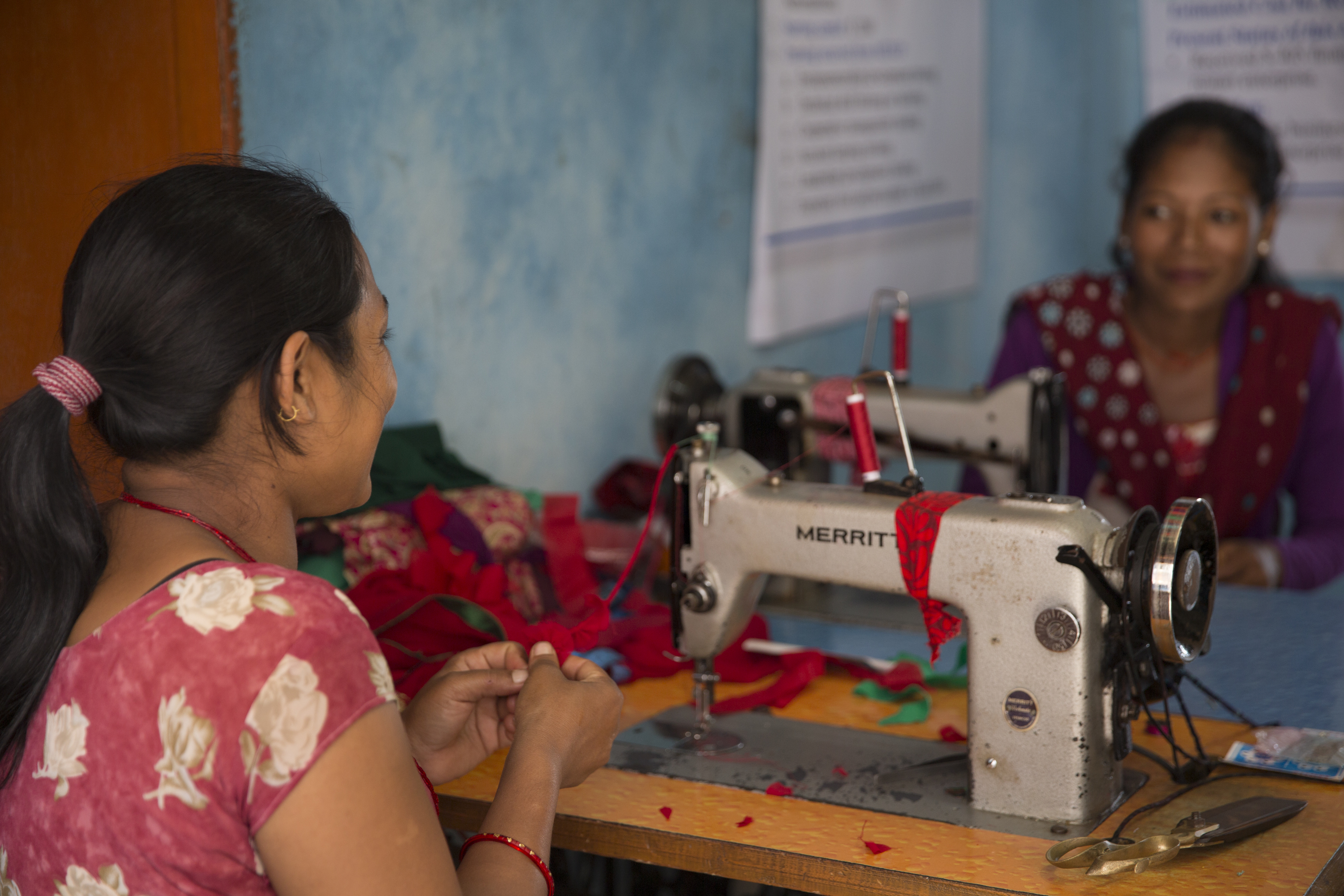 A custom order underway at a sewing shop, one venture created with help from the Micro-Enterprise Development Program (MEDEP).