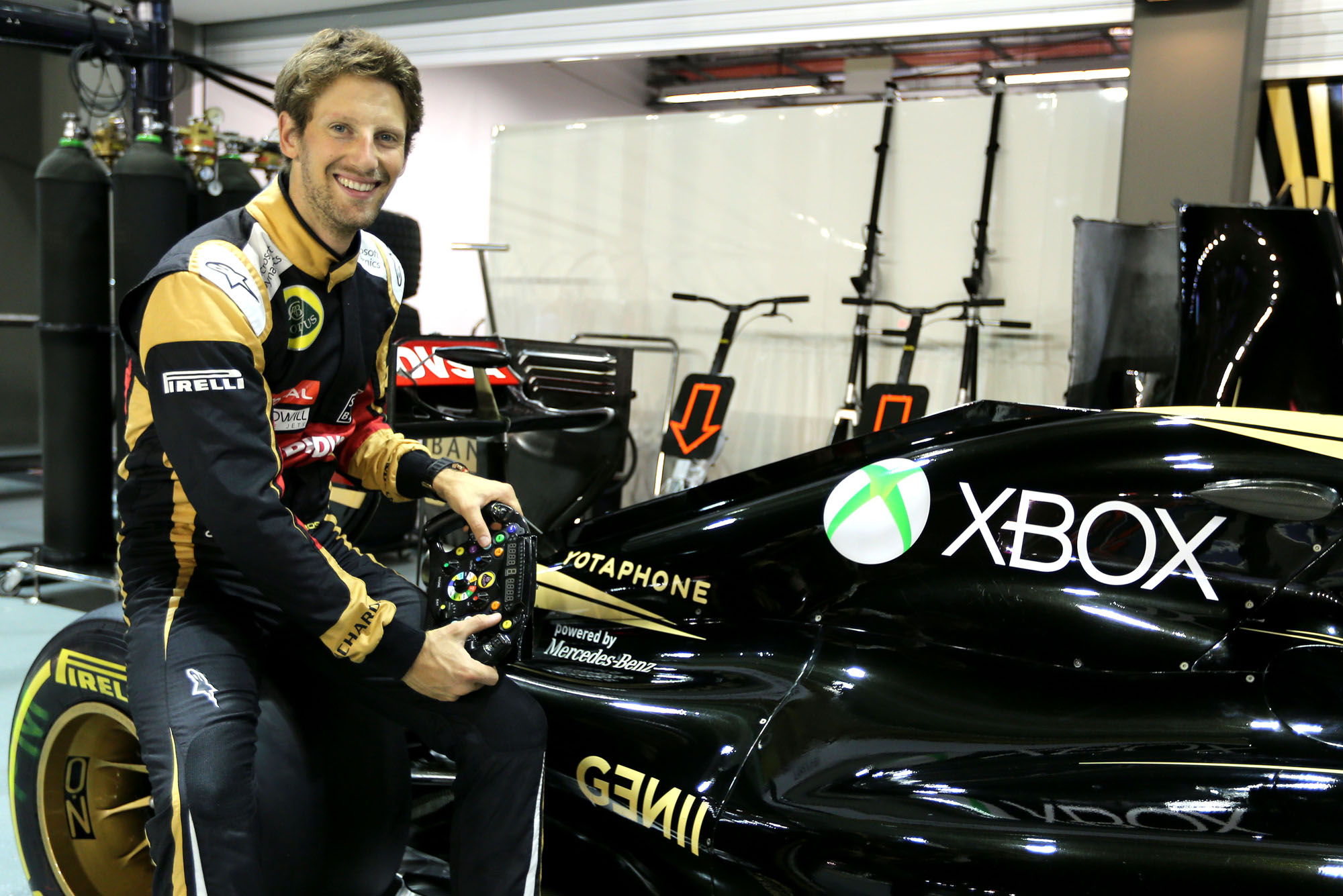 Lotus F1 Team Driver Romain Grosjean with his Xbox-branded E23 Hybrid