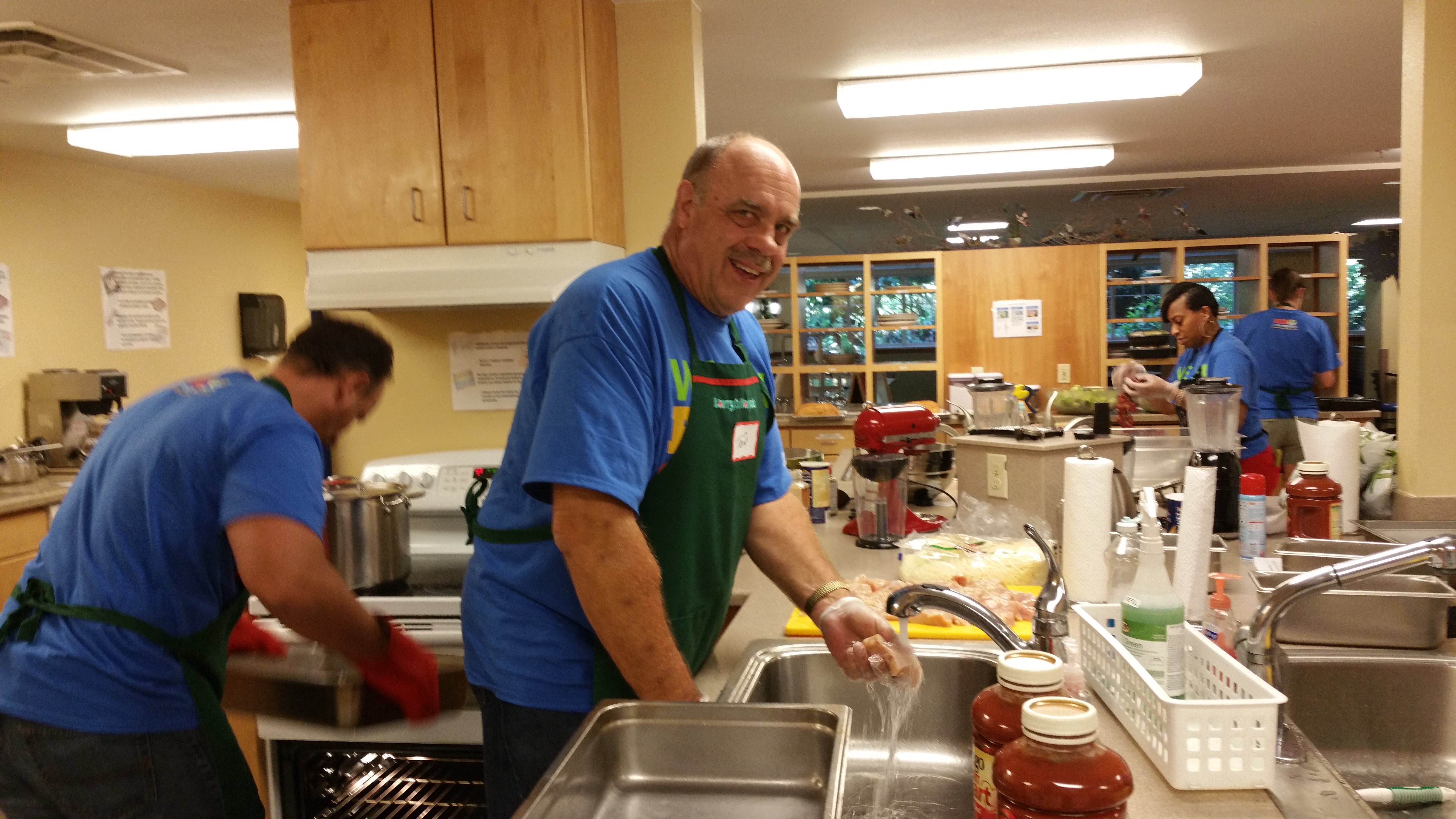 Microsoft loaned professional Tom Brown helps prepare dinner for hospitalized children and their families at Ronald McDonald House.