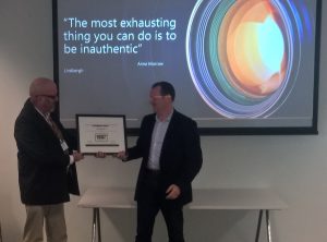 Michael Stevens, Programme Director for Rainbow Tick presents Microsoft NZ Managing Director, Barrie Sheers, with the certificate of Rainbow Tick accreditation. 