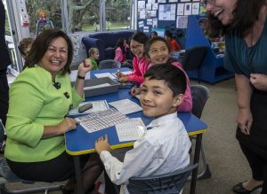 Minister for Education, Hon. Hekia Parata with students learning computational thinking through the CS Unplugged program. 