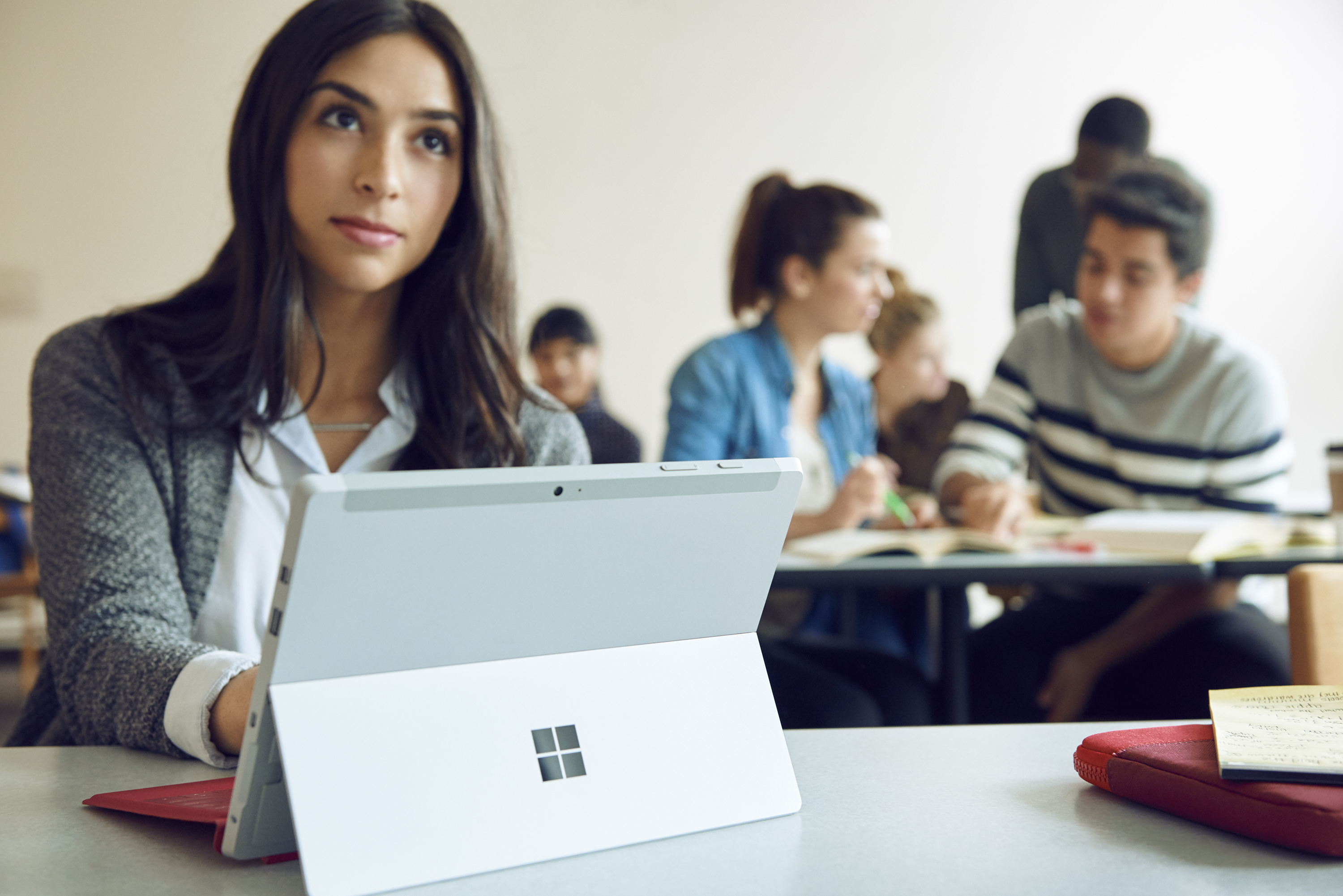 Female student using SUrface laptop in classroom