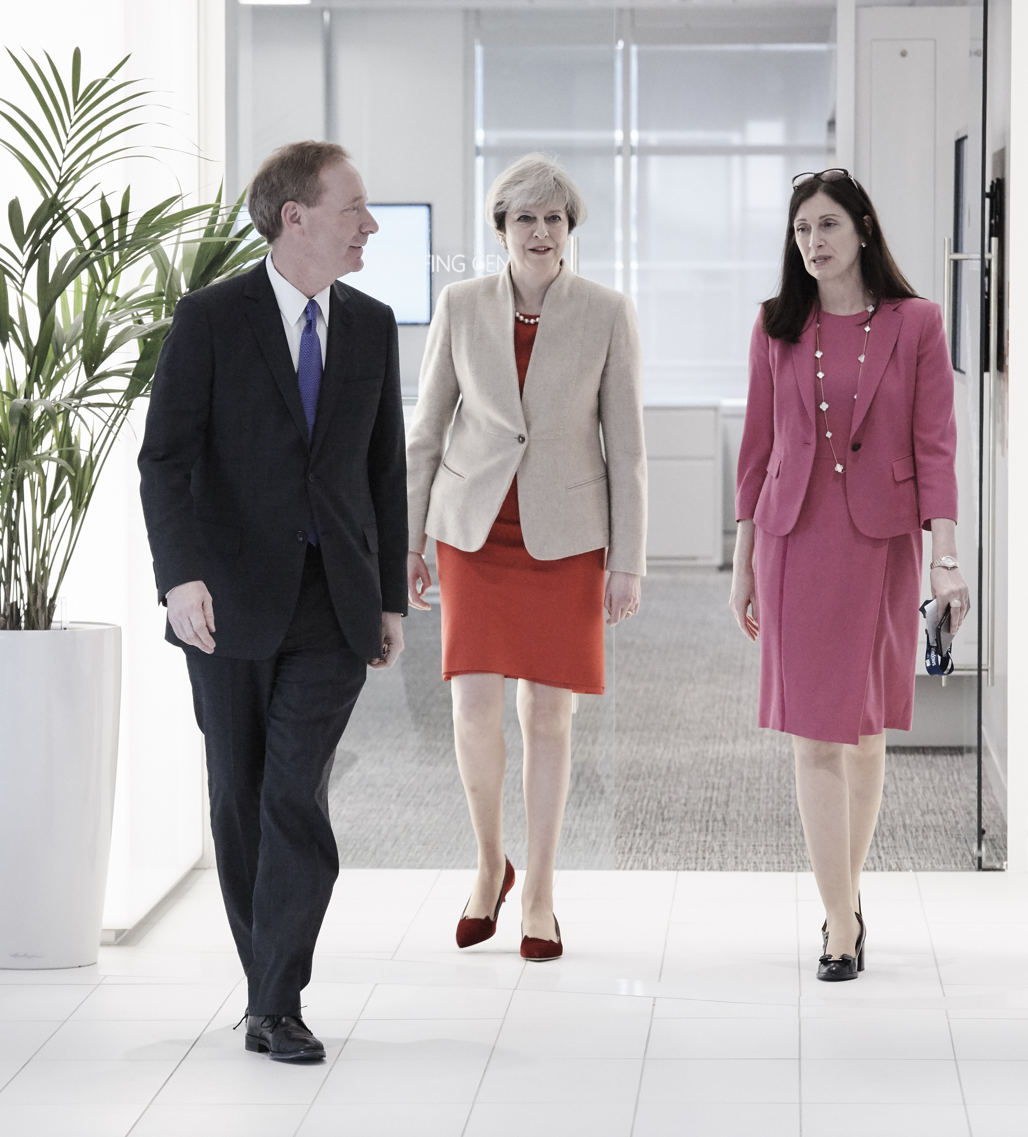 From left: Microsoft President Brad Smith, Prime Minister Theresa May and Microsoft UK Chief Executive Cindy Rose