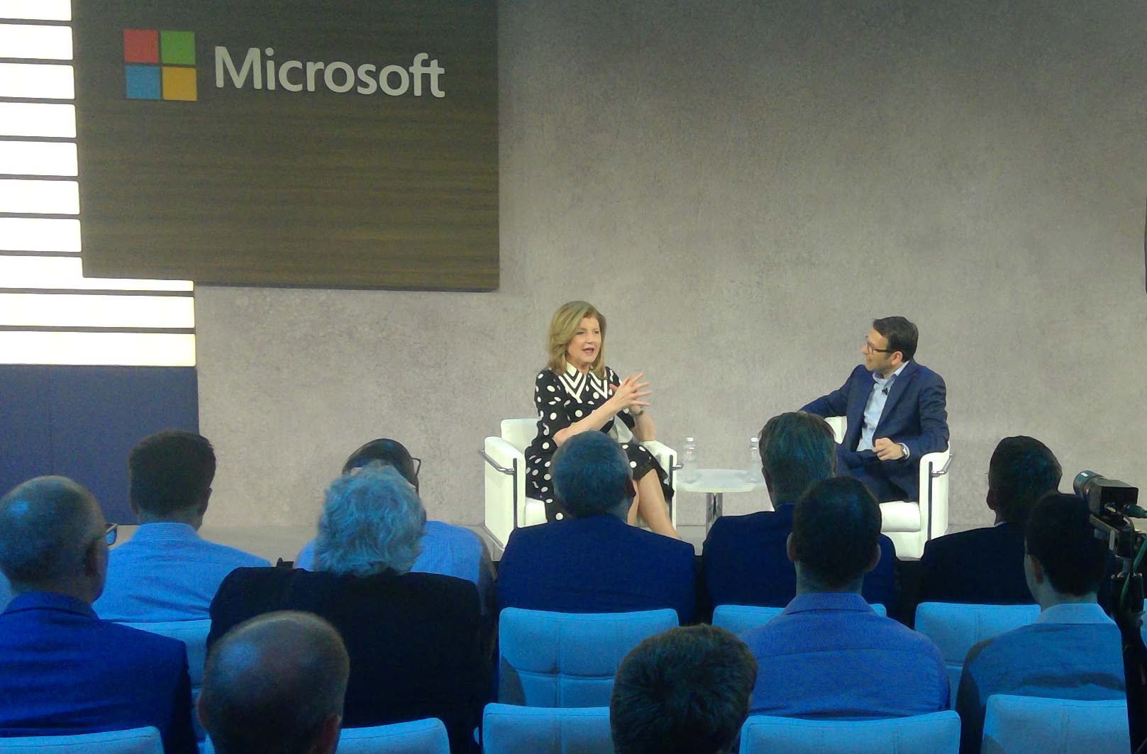 Arianna Huffington and Judson Althoff on stage at Business Forward