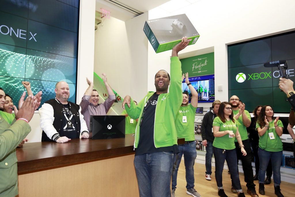 An Xbox fan celebrates being the first to purchase the new Xbox One X console at the flagship Microsoft Store on Fifth Ave. on Monday, Nov. 6th, 2017, in New York City