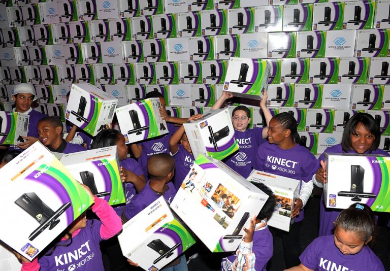 New York Boys & Girls Clubs members celebrate Microsoft's donation of 4,000 Kinect units to Boys & Girls Clubs of America at the Kinect for Xbox 360 launch event in Times Square on November 3, 2010 in New York City.