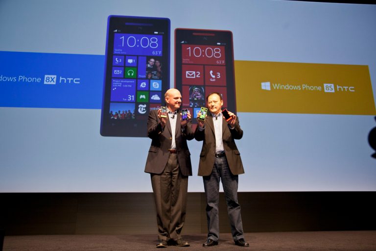 Steve Ballmer, CEO of Microsoft, and Peter Chou, CEO and President of HTC, show off the latest smartphones from HTC running the new Windows Phone 8 operating system.