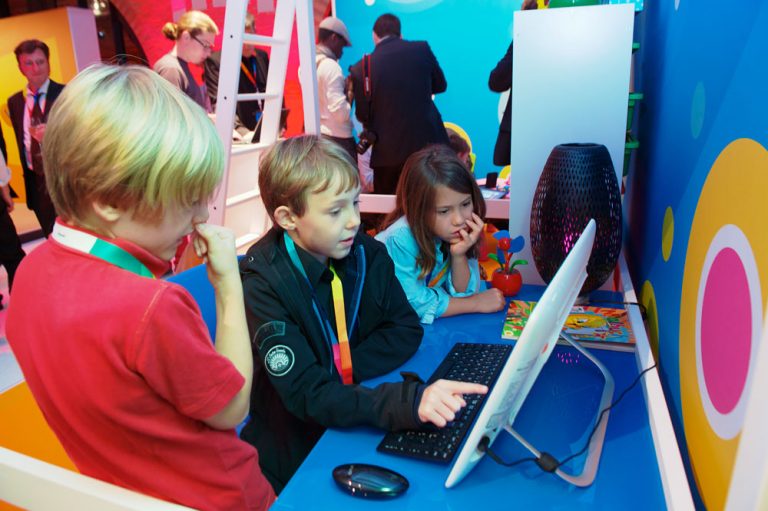 At the Windows 8 launch event in Germany, young children experience the newly redesigned Windows 8