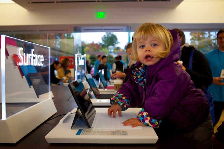 Daughter of Rob Nehrbas, Microsoft Dynamics employee, tests out the new Surface Touch Cover at the Microsoft Store in Seattle, Oct. 26, 2012.