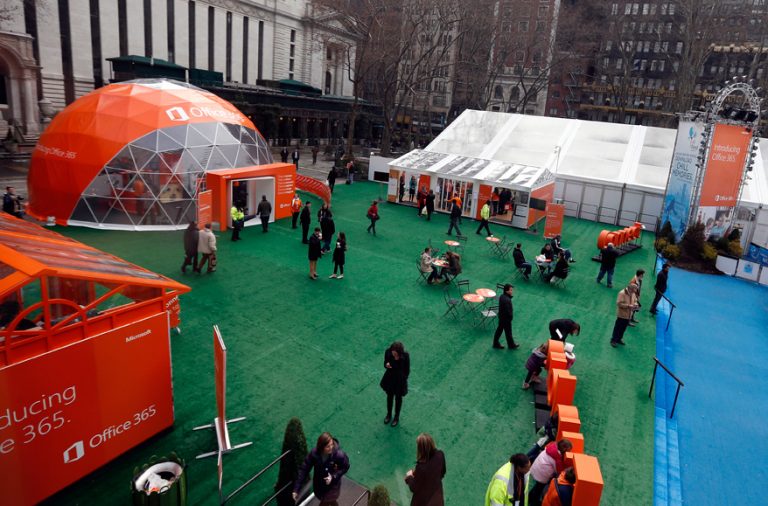 People stroll through Citi Pond Bryant Park in New York and explore ways the new cloud service helps them get more done.