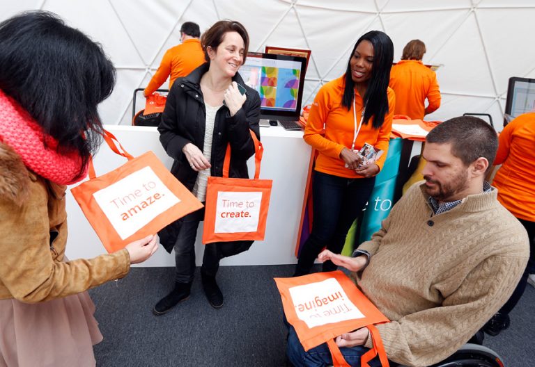 People attending the Office 365 Home Premium launch admire their silkscreened totes at Citi Pond Bryant Park in New York. The new consumer cloud service works across devices to help busy people simplify their lives and get more done.