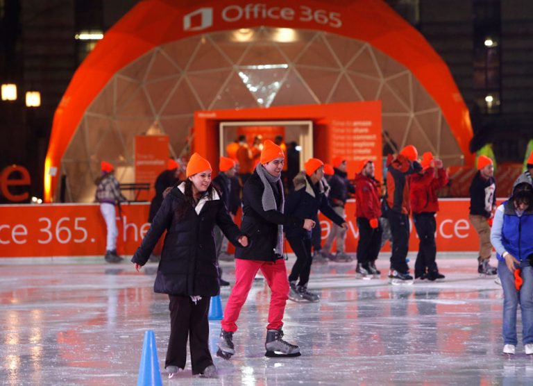 Skaters at Citi Pond Bryant Park in New York stay warm with orange caps while gliding past the Office 365 Home Premium area. The new service is flexible — it goes wherever you go and is full of features that help you find time to do the things you want.