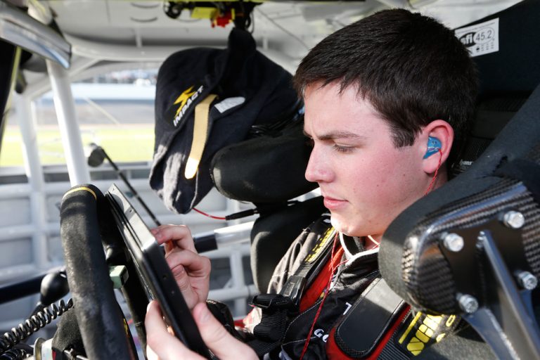 RAB Racing with Brack Maggard driver Alex Bowman inputs performance results on his Surface Pro before his qualifying run.