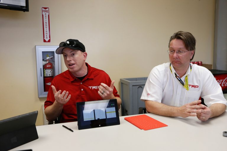 From left to right: Darren Jones, group lead for software development at TRD, and Steve Wickham, vice president of chassis operations at TRD, discuss TRD’s Trackside app running on Windows 8.