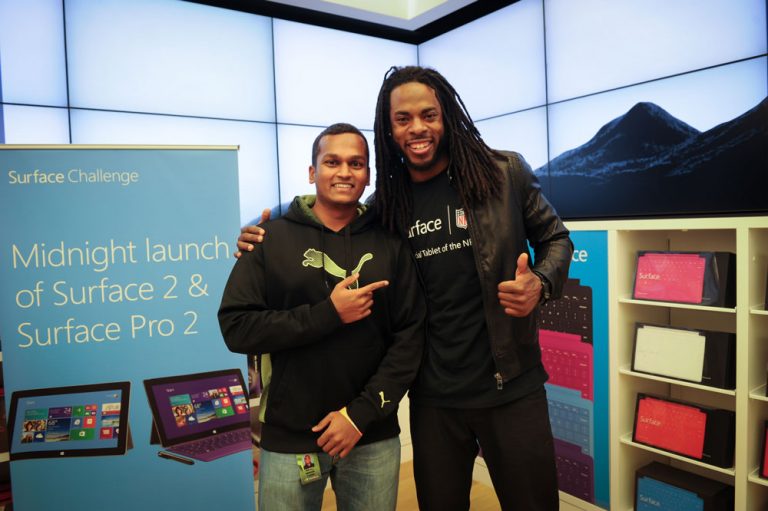 Arul Sekar, winner of the Surface 2 Challenge, poses with Seattle Seahawks All-Pro Cornerback Richard Sherman on Oct. 22 in Bellevue, Wash.