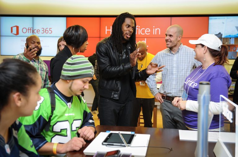 Seattle Seahawks All-Pro Cornerback Richard Sherman coaches consumers at the Surface 2 Midnight Launch for Surface 2 and Surface Pro 2 at the Bellevue Square Microsoft Store in Bellevue, Wash. on Oct. 21, 2013.