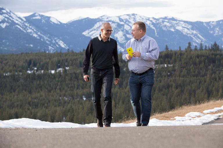 Microsoft CEO Satya Nadella (left) and executive vice president of Microsoft Devices Group Stephen Elop share a moment as the deal that brings together Microsoft and the Nokia Devices and Services business closes today.