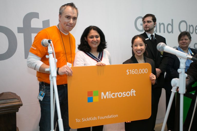 Stefanie McPherson accepts a $160,000 software grant during the Microsoft retail store ribbon-cutting ceremony at the Square One Shopping Centre in Mississauga, Ontario, on Feb. 8, 2014.