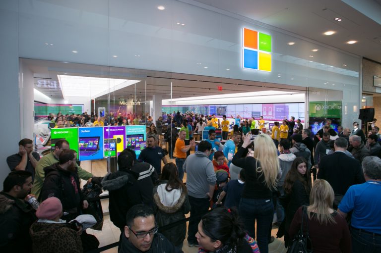 Excited fans enter the Microsoft retail store at Square One Shopping Centre in Mississauga, Ontario, after it opens on Feb. 8, 2014.