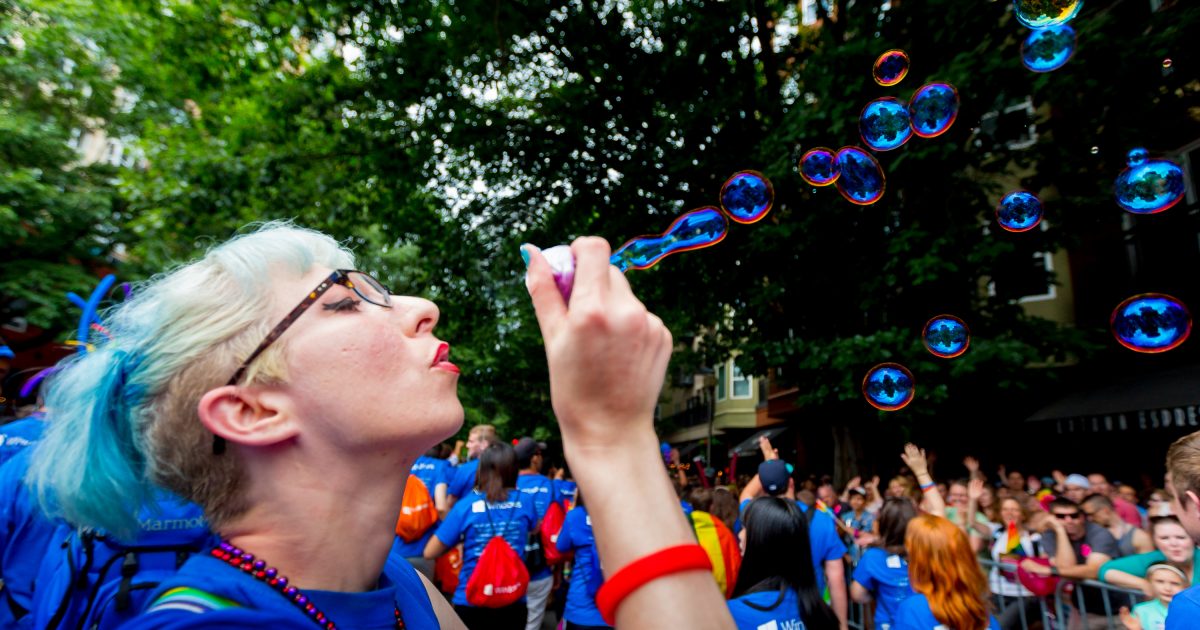 Blowing bubbles in Seattle’s festive Pride celebration.