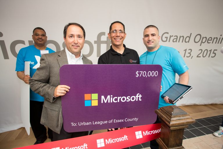 Local community organizations accepted more than $1 million in technology grants from Microsoft at Willowbrook Mall during the grand opening ceremony in Wayne, N.J., on June 13, 2015.