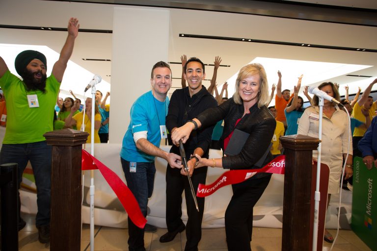 Neil Warwicker, Microsoft at Pacific Centre Store Manager, Yusef Mehdi, Microsoft Corporate Vice President, Windows and Devices, and Janet Kennedy, President, Microsoft Canada, cut the ribbon to open the company’s newest store at Pacific Centre in Vancouver, British Columbia, on Aug. 6, 2015.