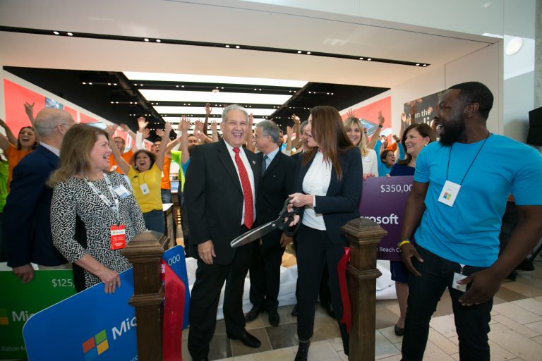 Kevin Reader, store manager, and Denise Rundle, General Manager of Services, cut the ribbon at the new Microsoft at Town Center at Boca Raton in Boca Raton, Fl., on Nov. 3, 2016.