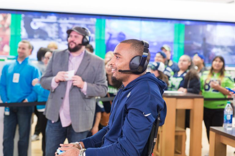 Excited fans gather to cheer on Seattle Seahawk Doug Baldwin at the Microsoft Store at Bellevue Square (Bellevue, Wash.) on Oct. 18, 2016.