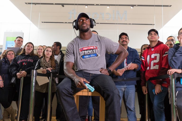 Excited fans gather to cheer New England Patriot Devin McCourty at the Microsoft Store at Prudential Center (Boston) on Nov. 1, 2016.