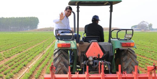 Prashant Gupta of Microsoft riding on the back of a tractor in India