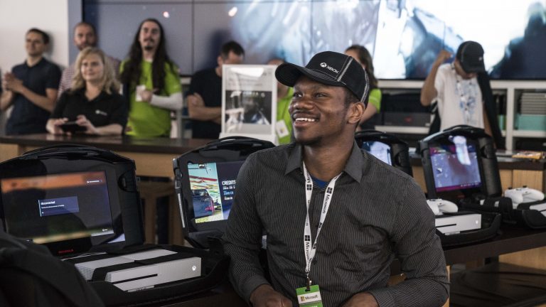 An excited fan watches the Xbox E3 2017 Briefing at Microsoft Store at Westfield Century City in Los Angeles on Sunday, June 11, 2017.