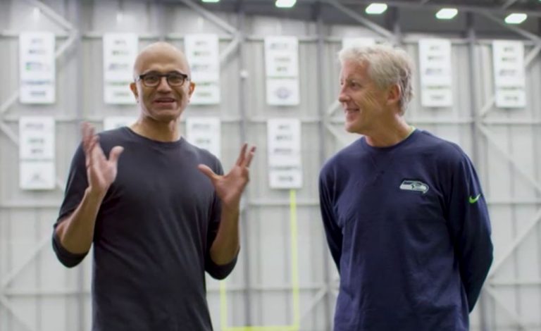 Satya Nadella and Pete Carroll stand next to each other