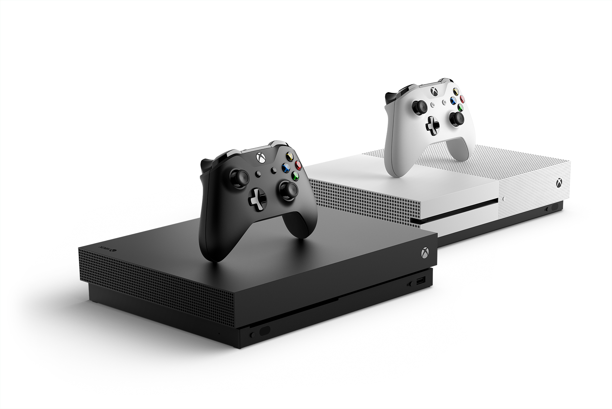 Xbox One X consoles and controllers in white and black