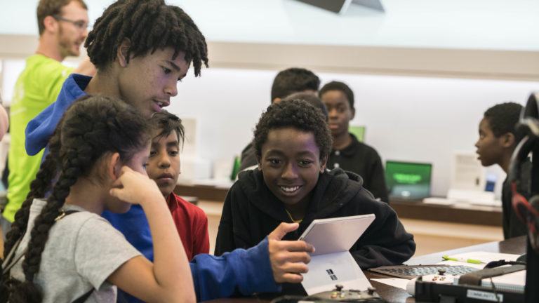 Students learn the basics of building video games with MakeCode Arcade during a free Microsoft Store Summer Camp.