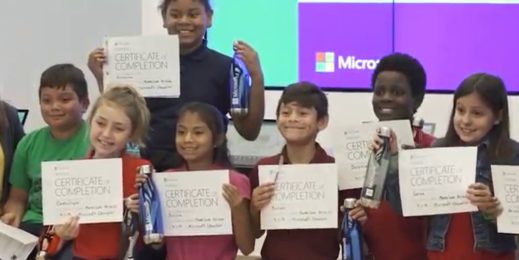 Kids holding certificates they earned at a Microsoft Store Summer Camp