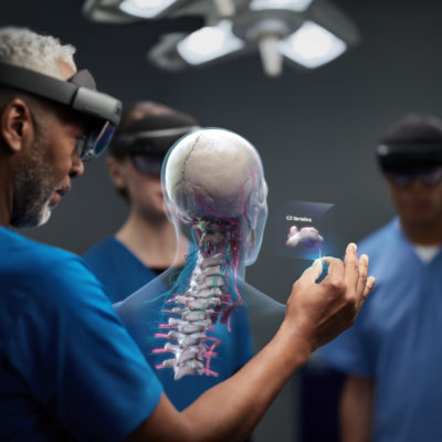 a doctor uses hololens to view a spine