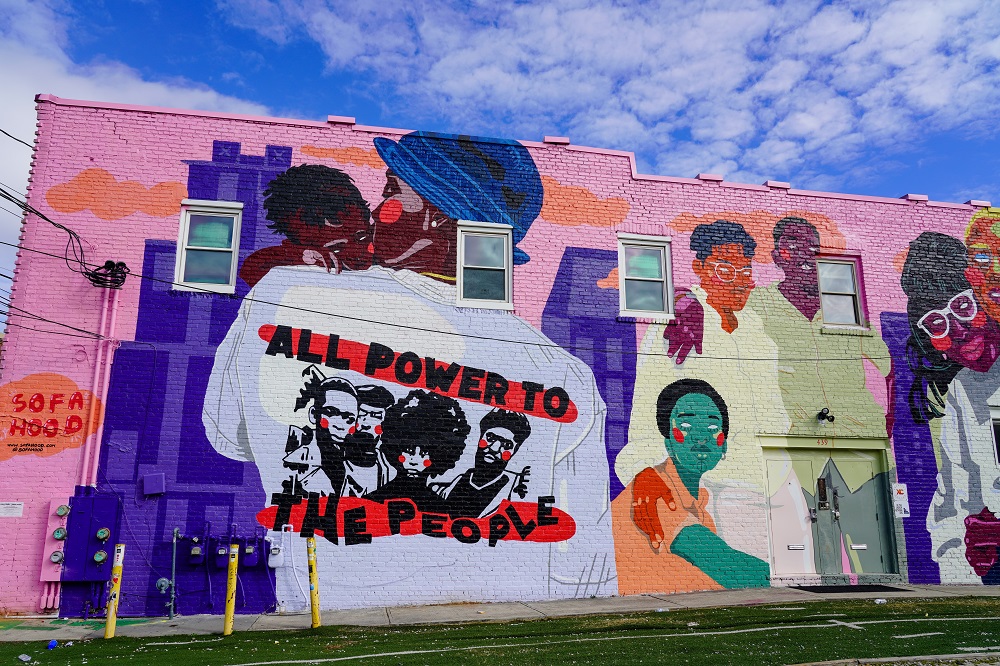 Colorful mural that says “all power to the people”