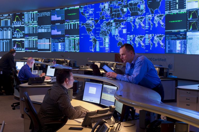 Four AT&T employees at work in the company's Operations Center