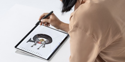 Man drawing on a Surface Pro 8