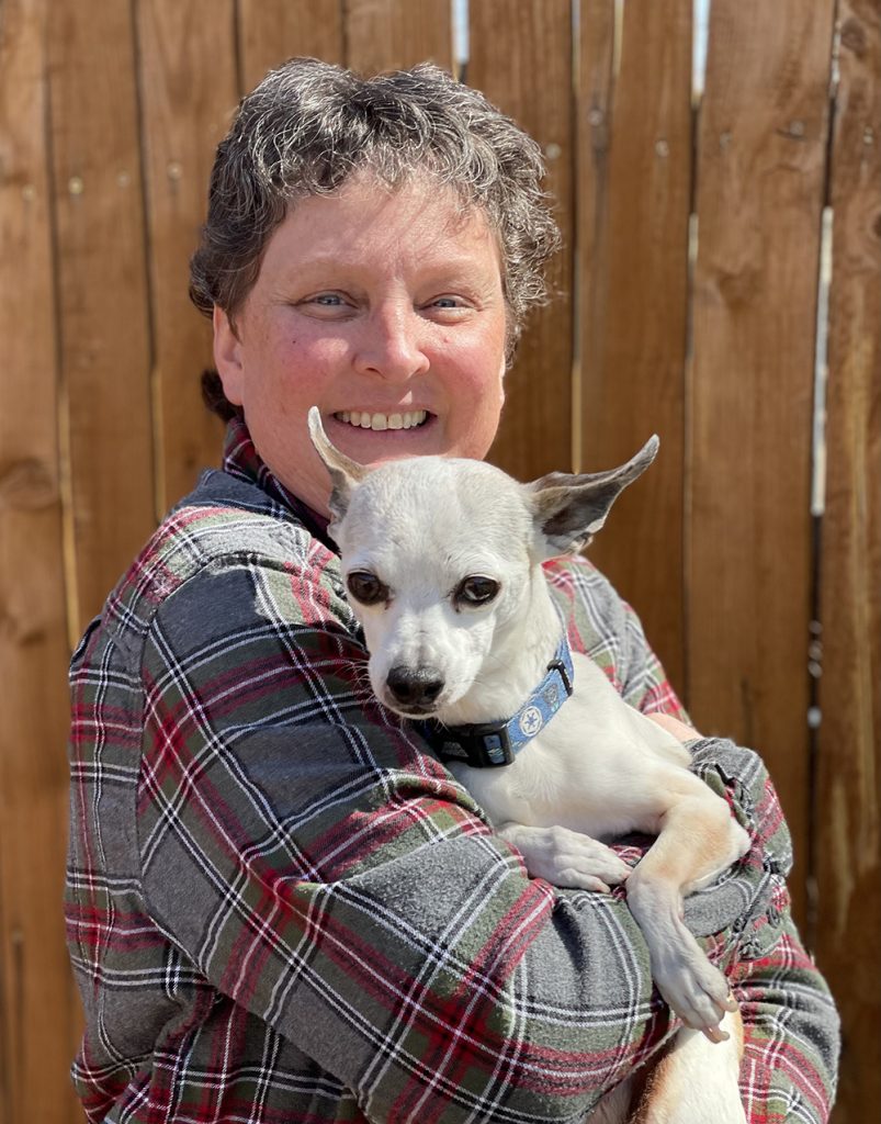 Woman holds a dog