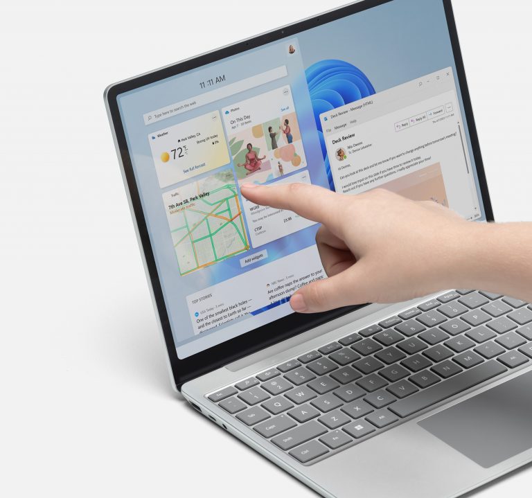 Person using touchscreen on Surface Laptop Go 2