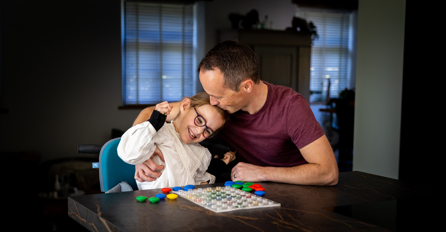 Man kissing his daughter on the head