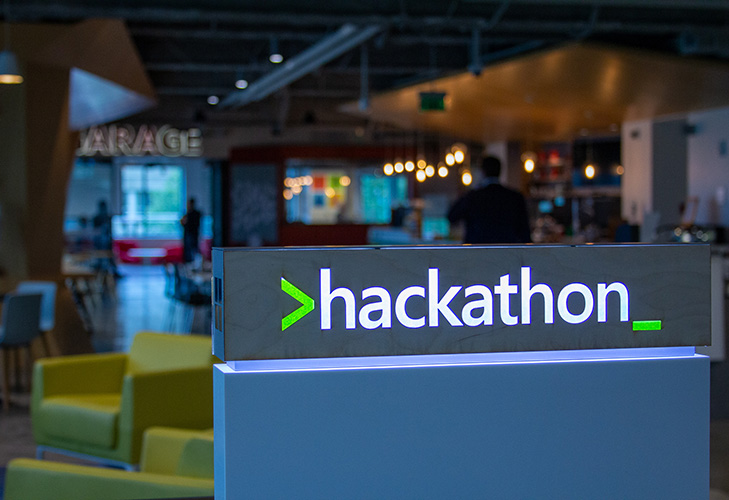 Hackathon sign shown in a room