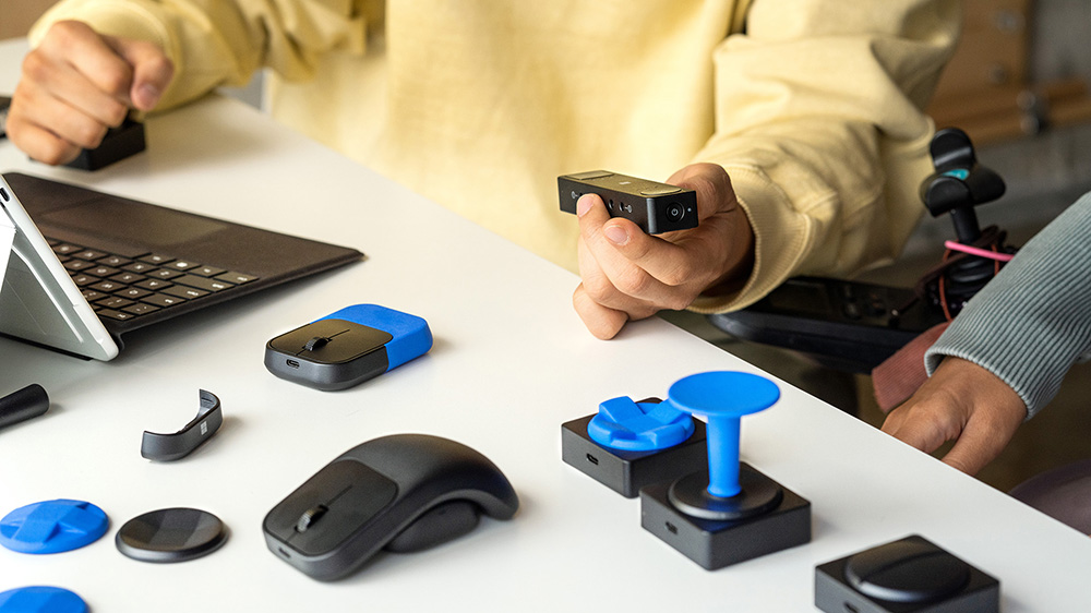 A person holds a Microsoft Adaptive Accessory
