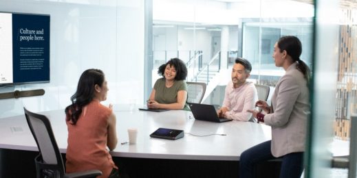 Four people meet in an office