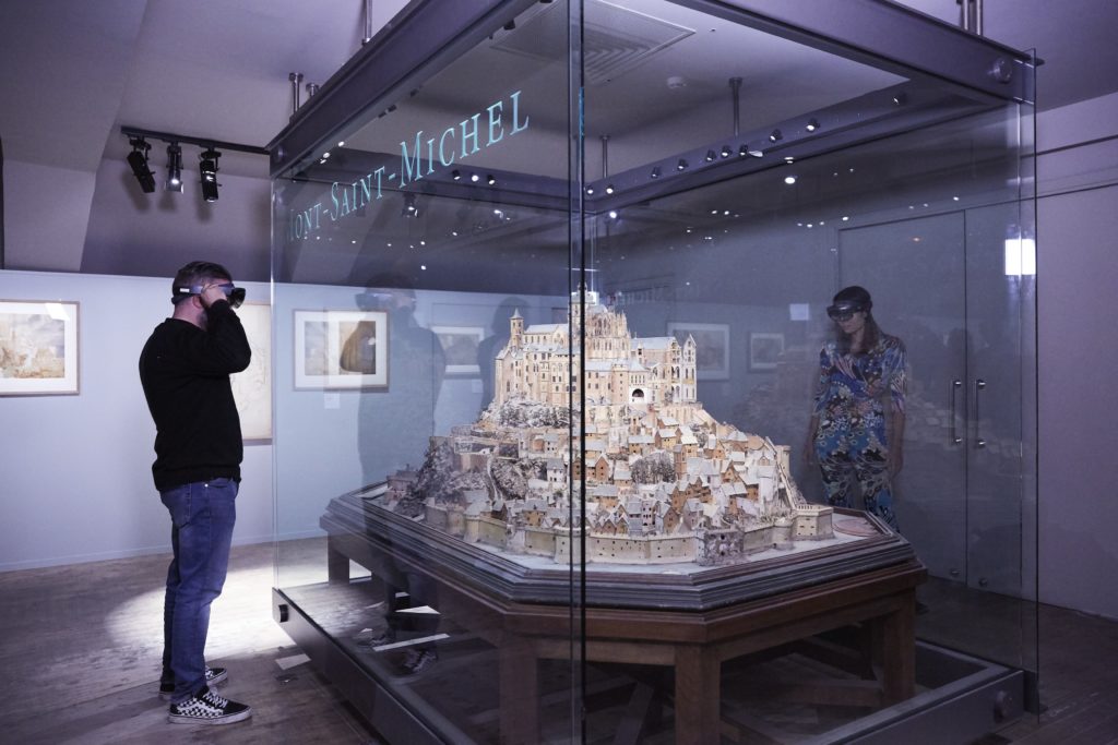 Museum visitors explore the Mont-Saint-Michel through an AI and mixed-reality-powered experie