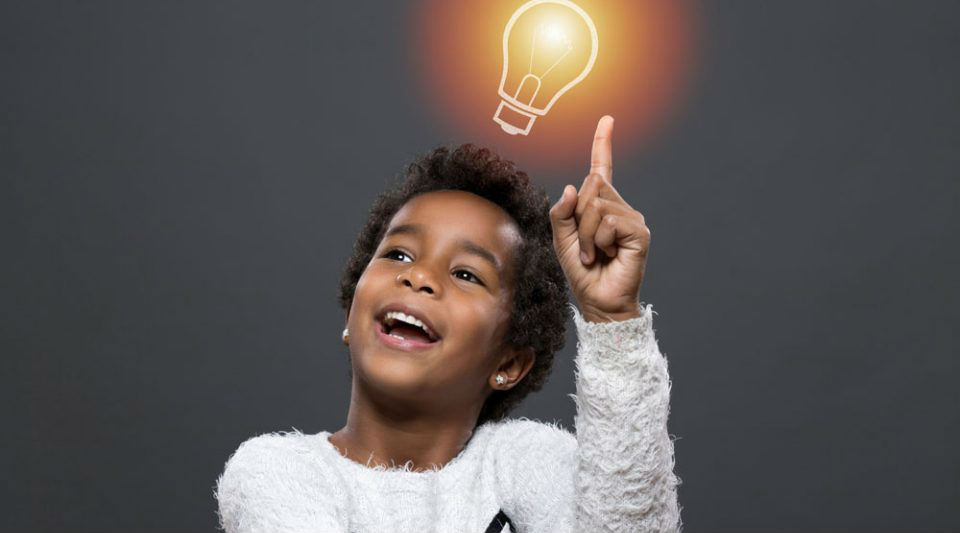 A boy with an idea, light bulb above his head