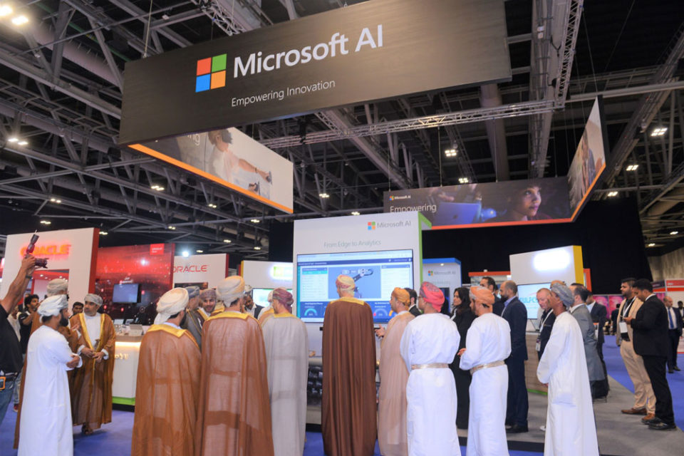 A photo by the Microsoft booth while visitors are actively viewing the screen presentation