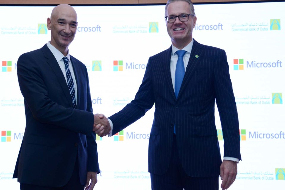 Picture of Microsoft spokesperson and CBD spokesperson shaking hands.